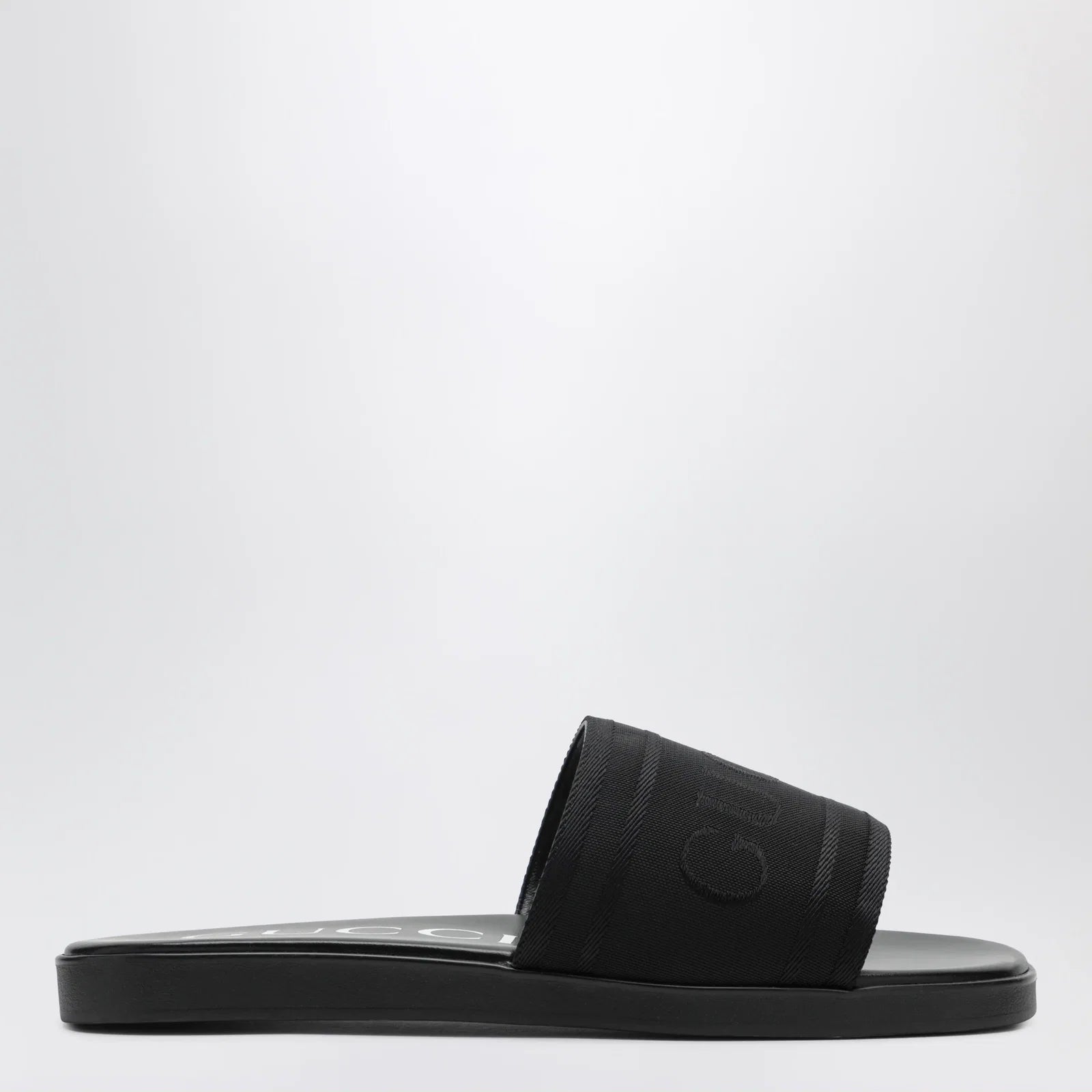 GUCCI Black jacquard fabric slides