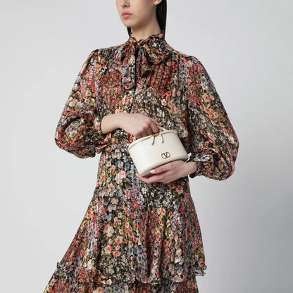 Valentino Garavani Vlogo Signature Mini Vanity Bag in ivory grained calfskin